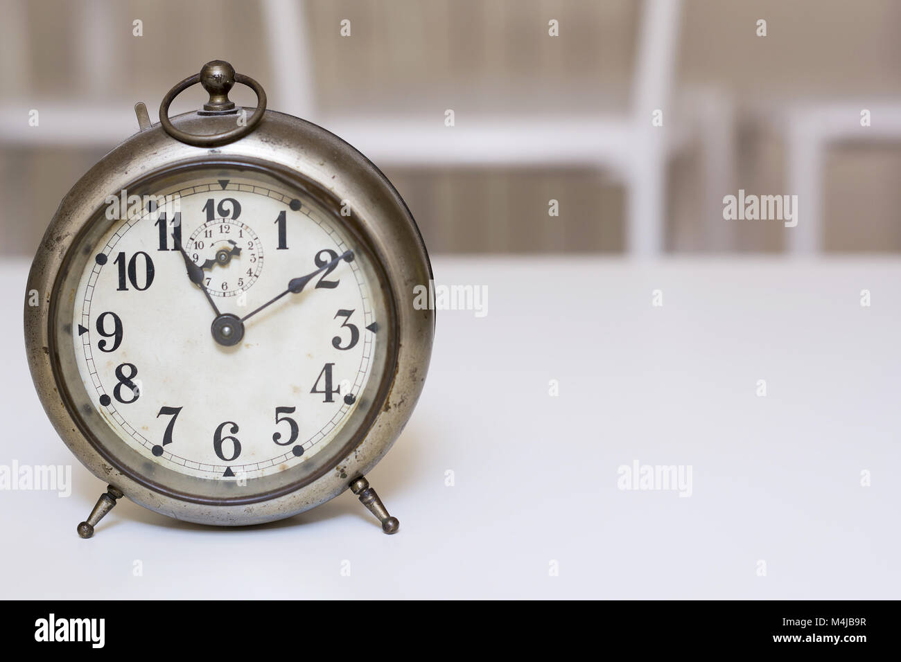 old clock on a white background Stock Photo - Alamy