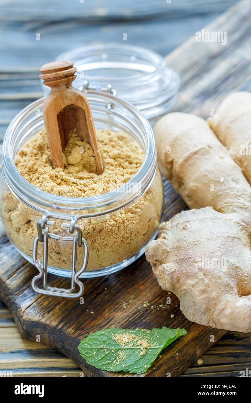 Ground ginger and scoop in a glass jar Stock Photo Alamy
