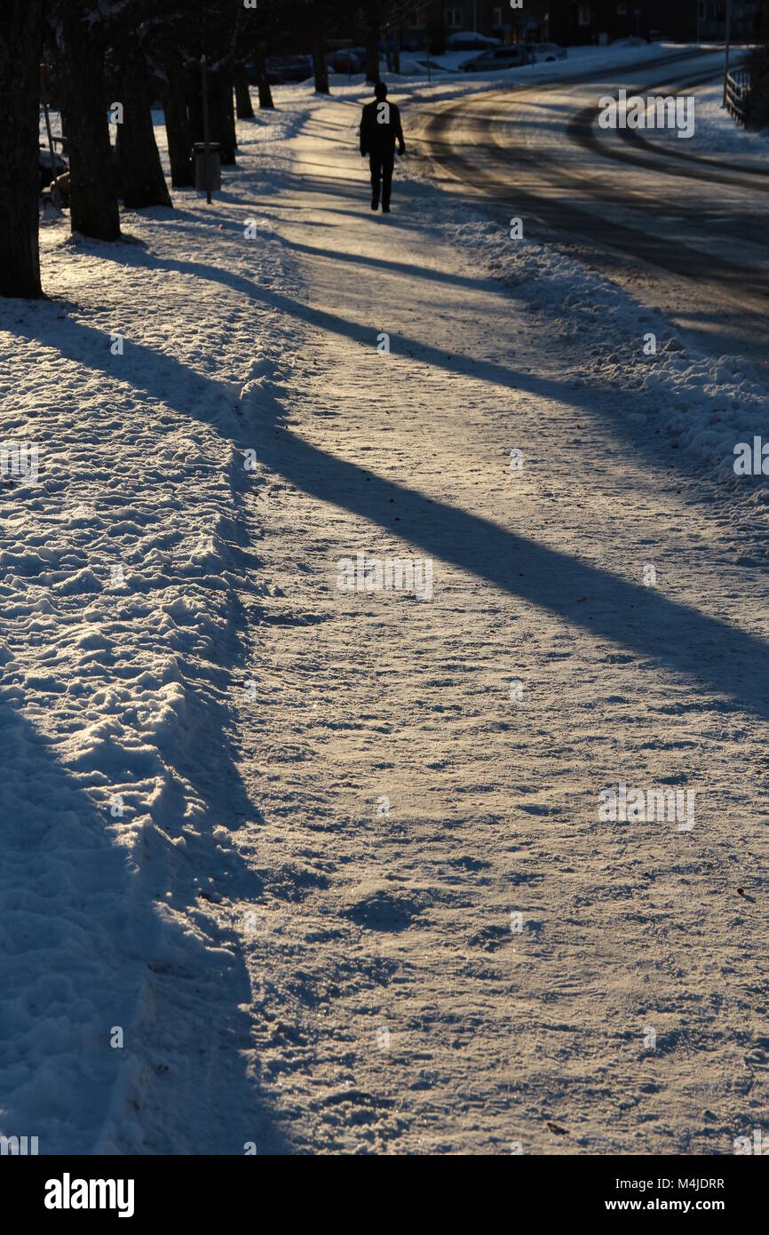 Man walking lonely road hi-res stock photography and images - Alamy