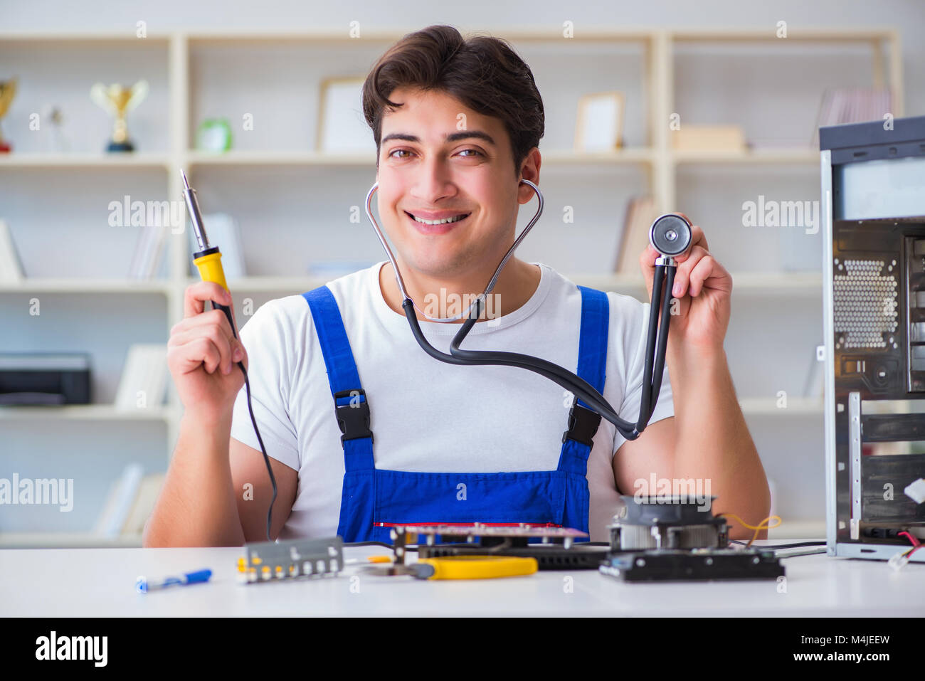 Computer repairman repairing desktop computer Stock Photo - Alamy