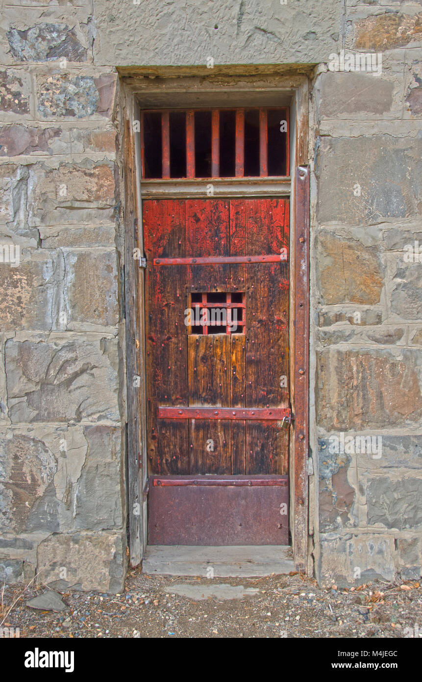 The old jailhouse door in Cimarron, New Mexicois pretty sturdy! Stock Photo