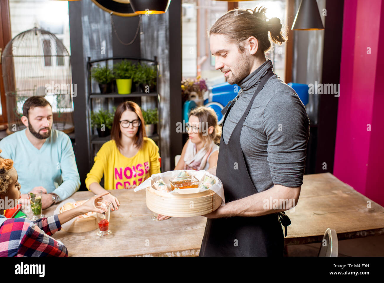 Serving asian meal at the restaurant Stock Photo Alamy