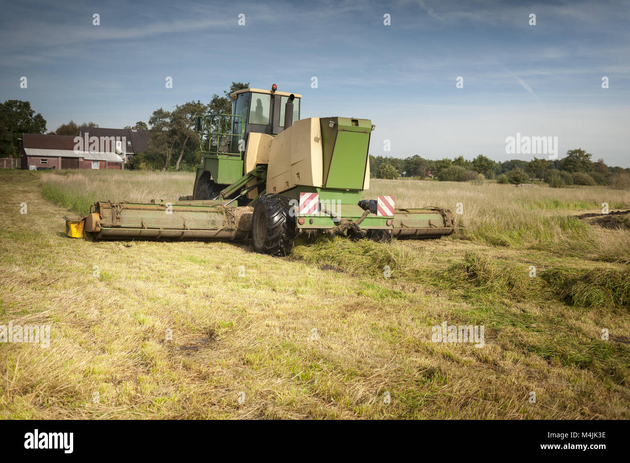 Hay-Combine at work Stock Photo - Alamy