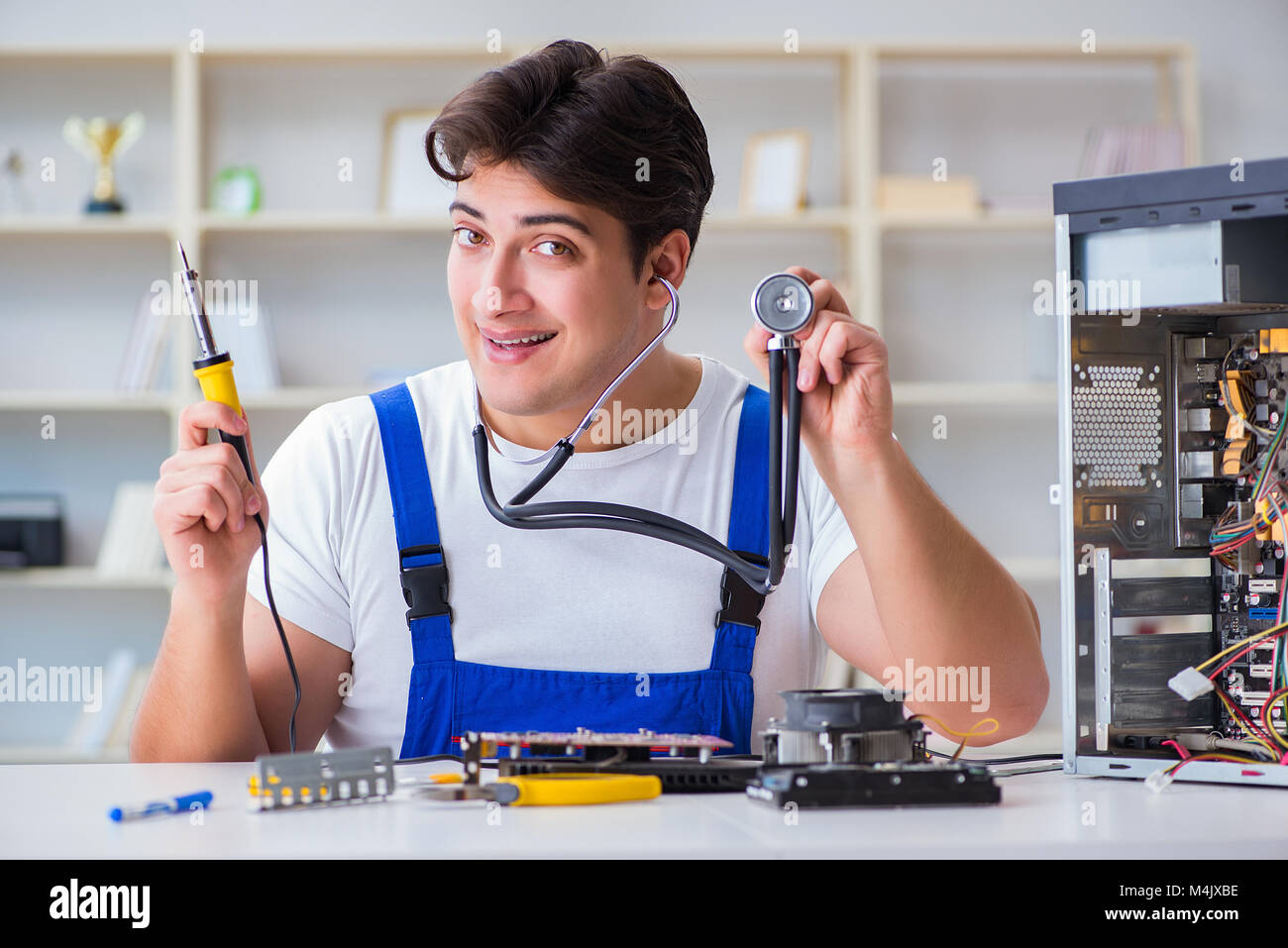 Computer repairman repairing desktop computer Stock Photo - Alamy
