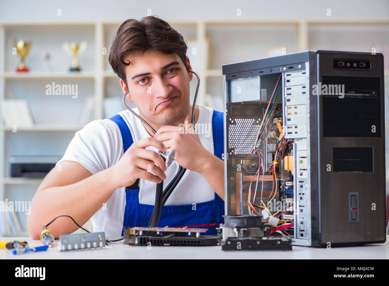 Computer repairman repairing desktop computer Stock Photo - Alamy