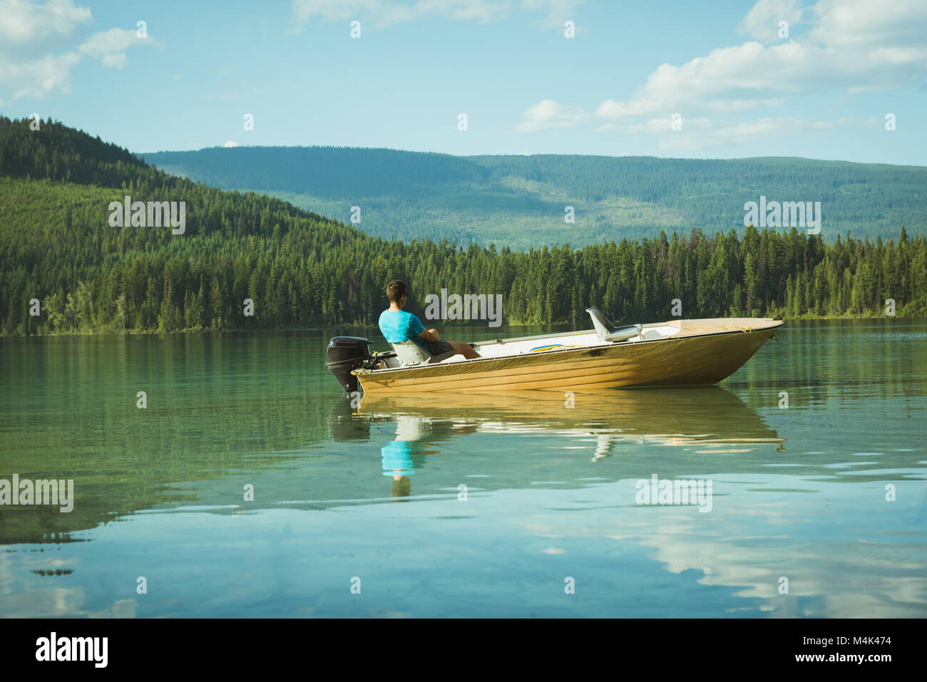 Man travelling on motorboat Stock Photo - Alamy