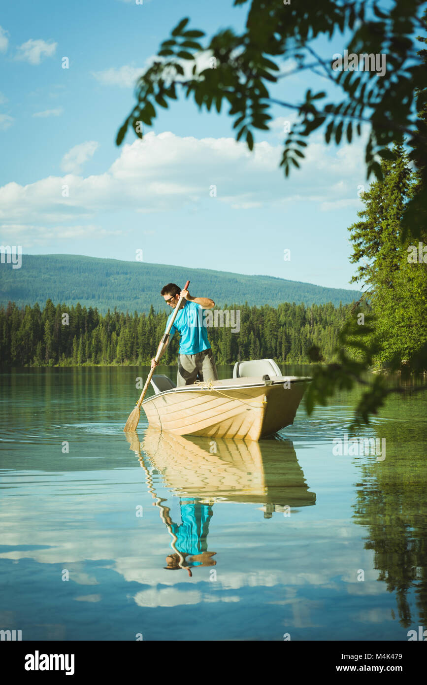 Man travelling on motorboat Stock Photo - Alamy
