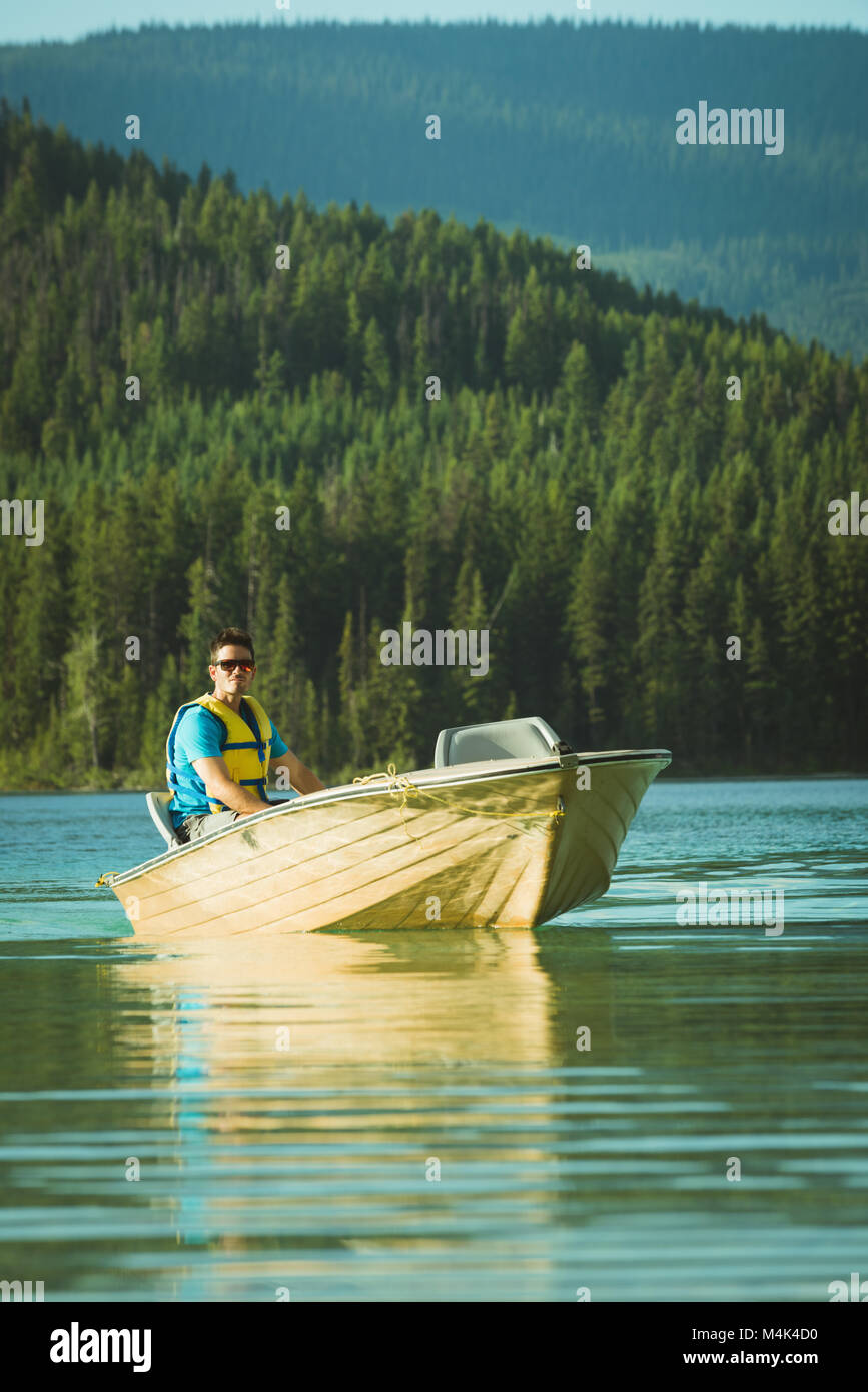Man travelling on motorboat Stock Photo - Alamy