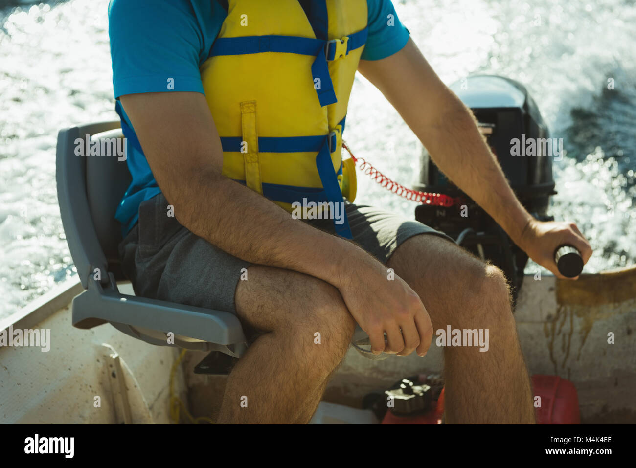 Man travelling in motorboat on a lake Stock Photo - Alamy