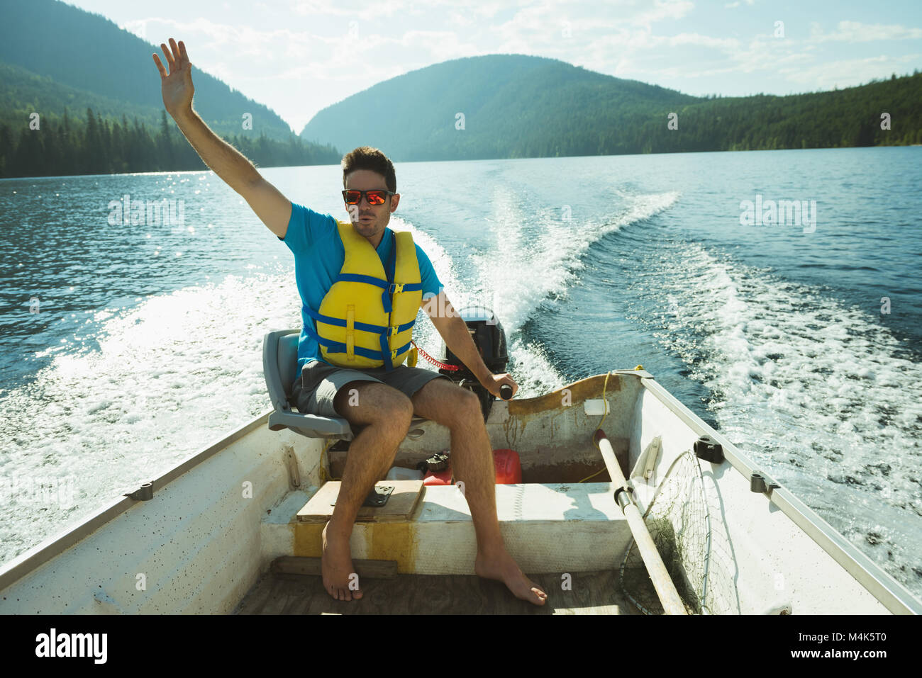 Man travelling in motorboat Stock Photo