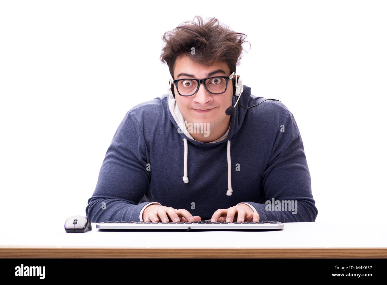 Funny nerd man working on computer isolated on white Stock Photo