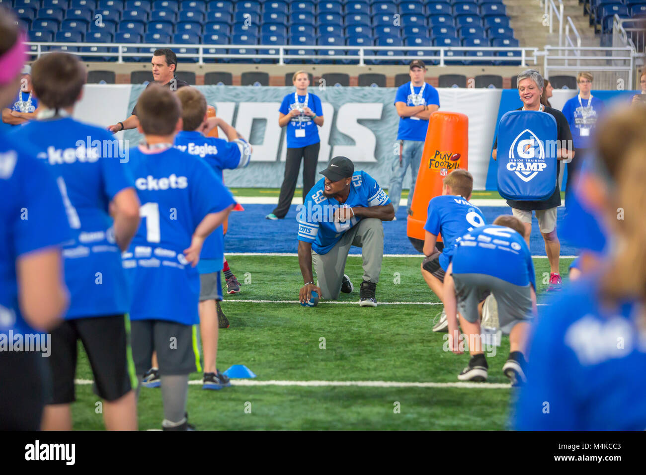 Detroit, Michigan - Detroit Lions linebacker Tahir Whitehead runs students through football drills during a physical activity and nutrition program at Stock Photo