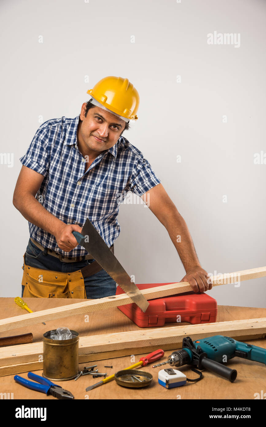 Handsome Indian Carpenter Or Wood Worker In Action Isolated Over White Background Stock Photo Alamy