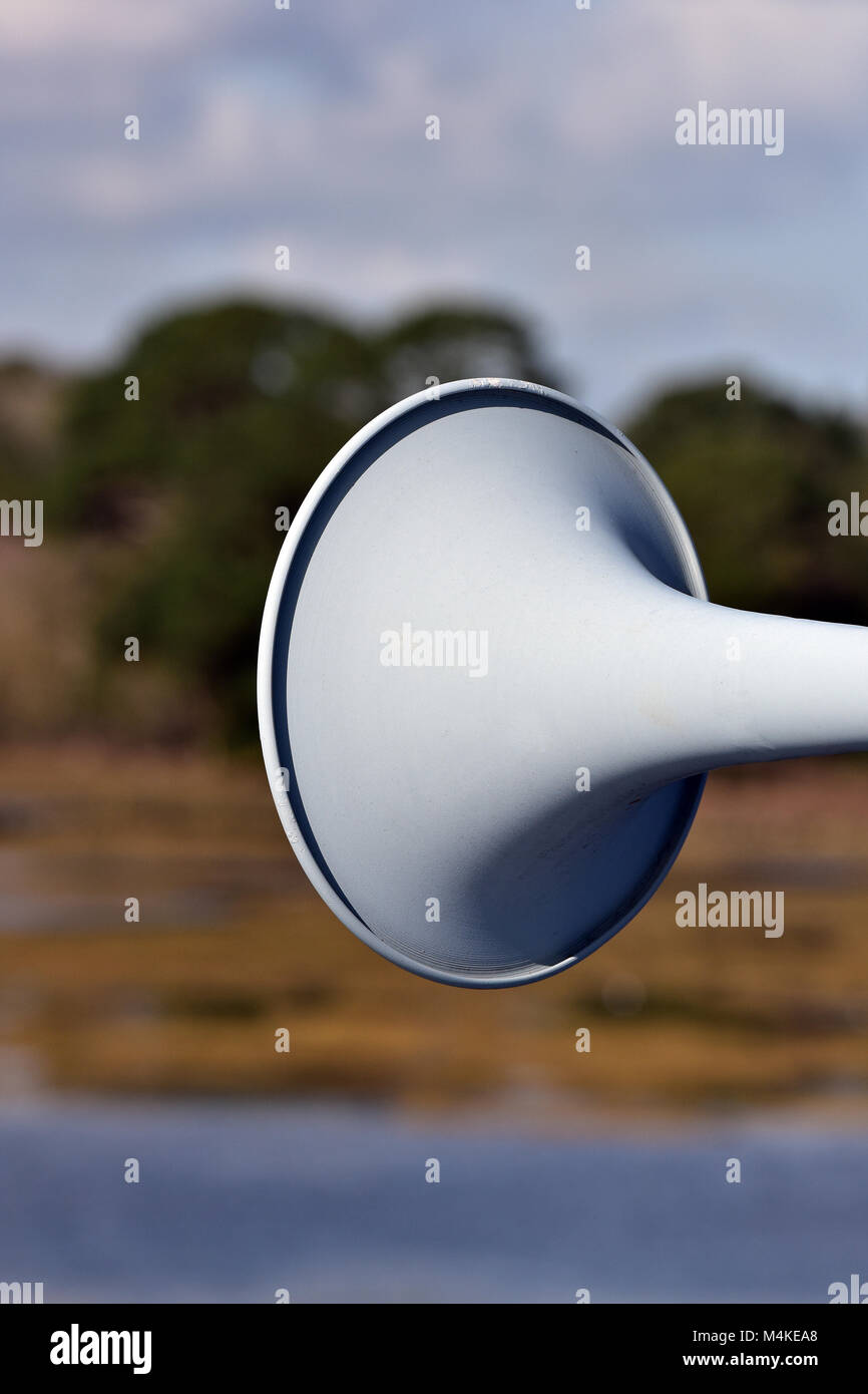 a loudspeaker or tannoy system horn shaped bell of a speaker system. loud hailer on a ships foghorn in a trumpet shaped bell for making a noise or din Stock Photo