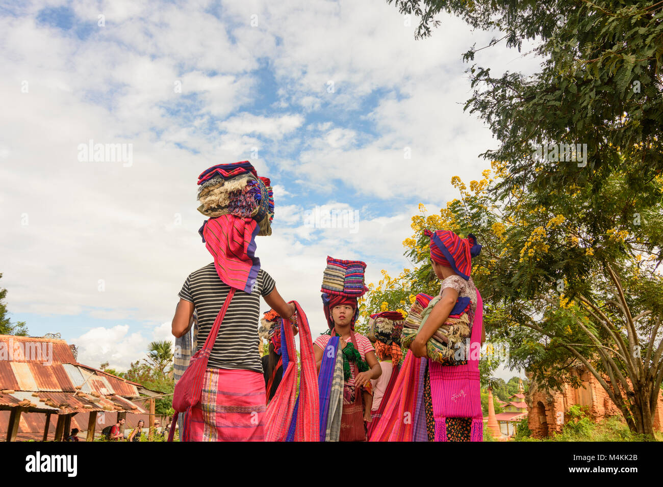 Inthein: woman vendor selling souvenir to tourists, Intha people, Inle ...