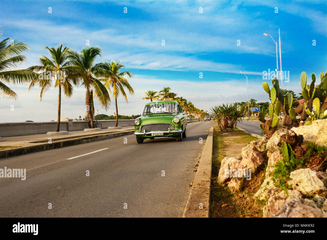 Cienfuegos, Cuba - December 7, 2017: Old green American car on the Cienfuegos Malecon Stock Photo