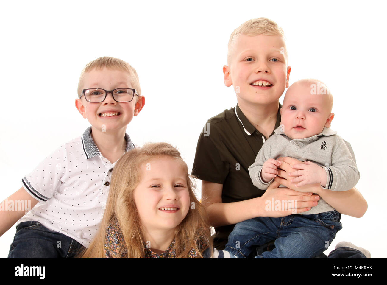 family life,four siblings happy and playing together, Big family Stock Photo