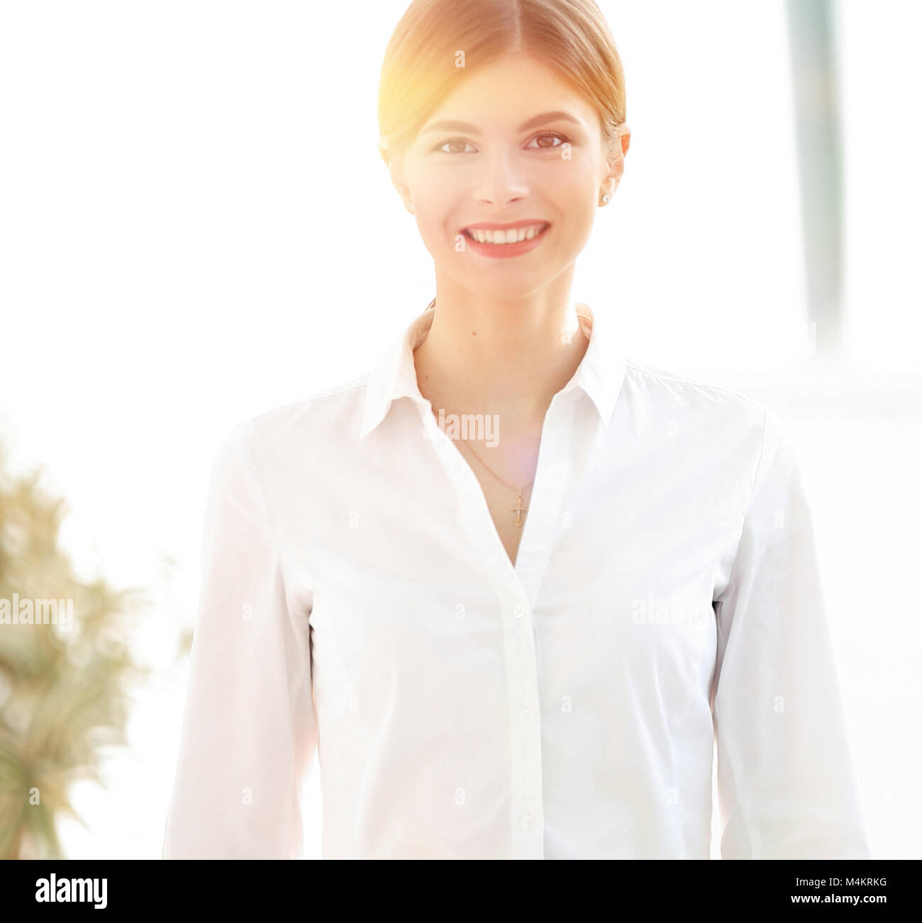 portrait of a smiling young woman assistant in the office Stock Photo ...