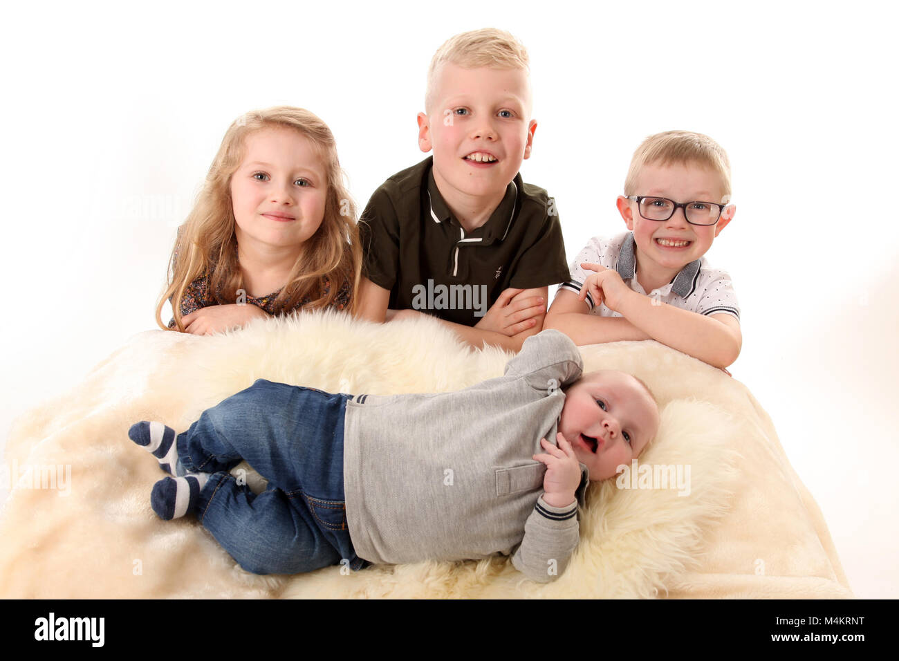 family life,four siblings happy and playing together, Big family Stock Photo