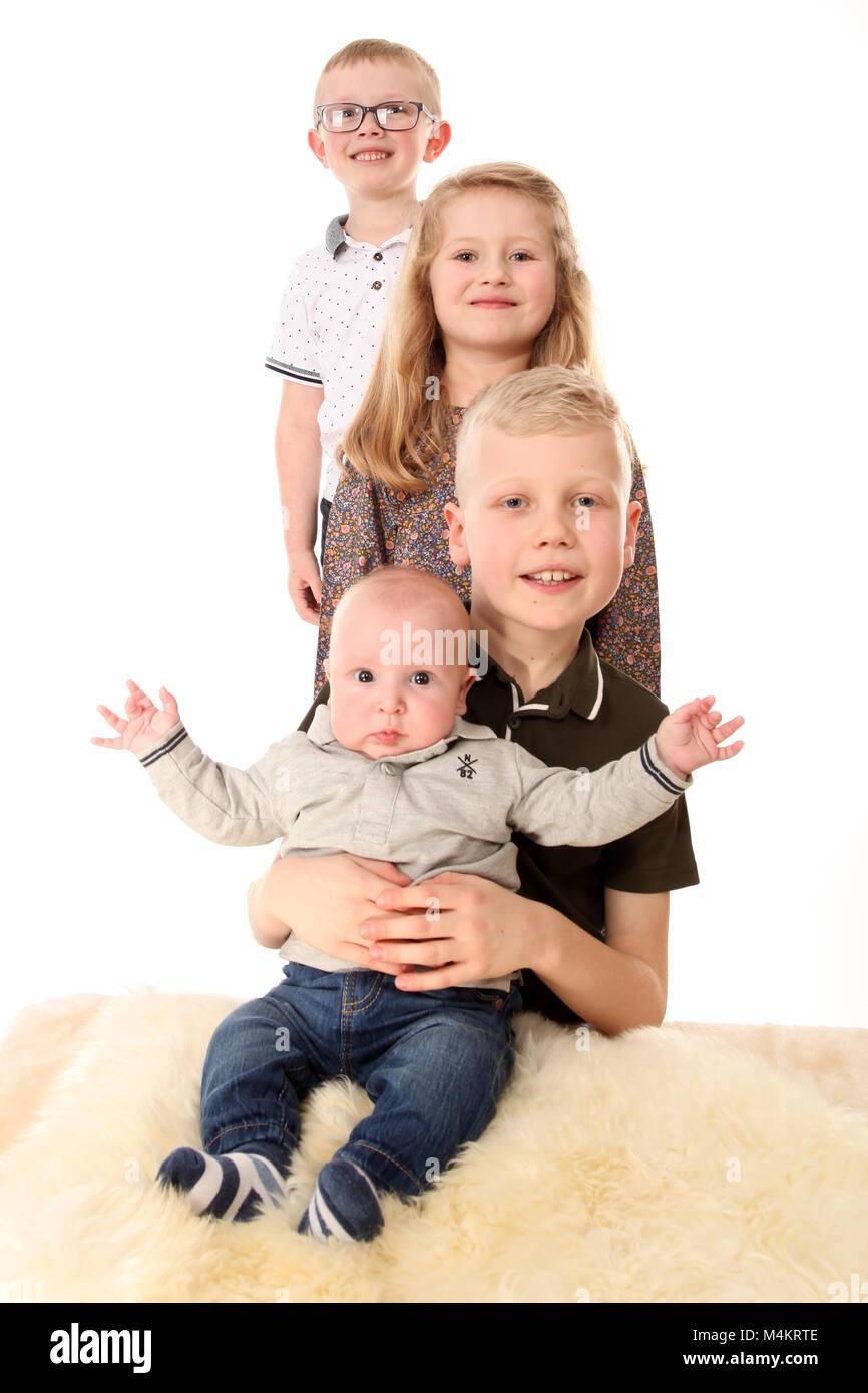 family life,four siblings happy and playing together, Big family Stock Photo