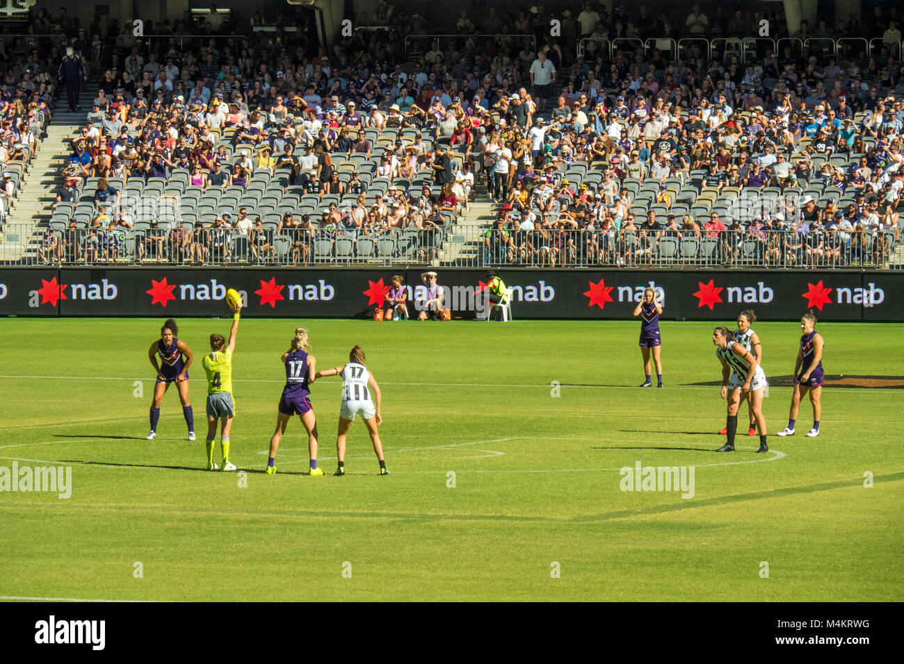 AFL Fremantle Football Club Women's team playing against Collingwood in front of a record attendance at Optus Stadium, Perth, WA, Australia. Stock Photo