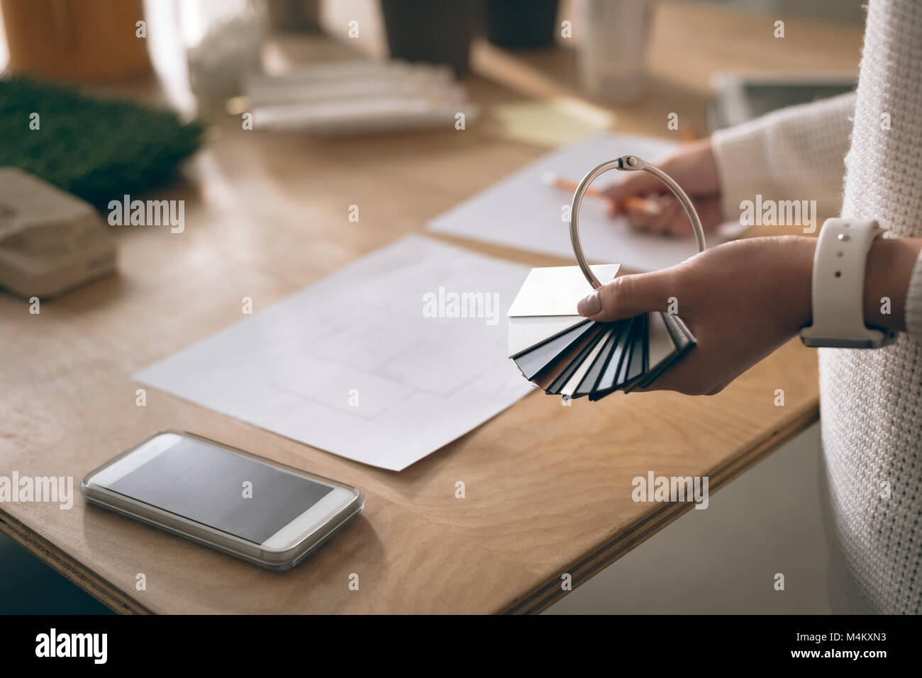 Executive holding sample of slabs in office Stock Photo