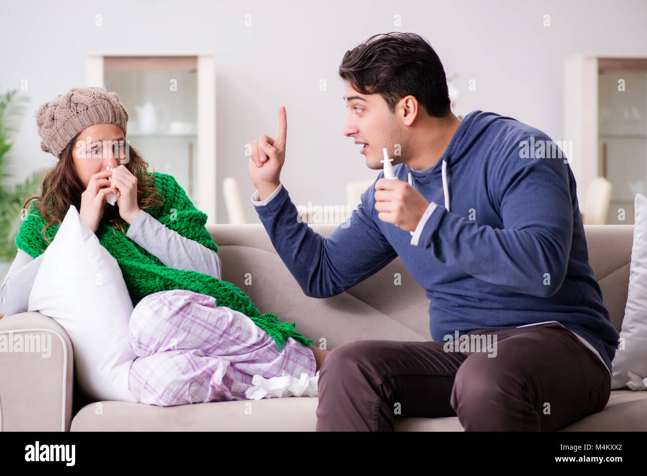 Husband caring for sick wife Stock Photo - Alamy