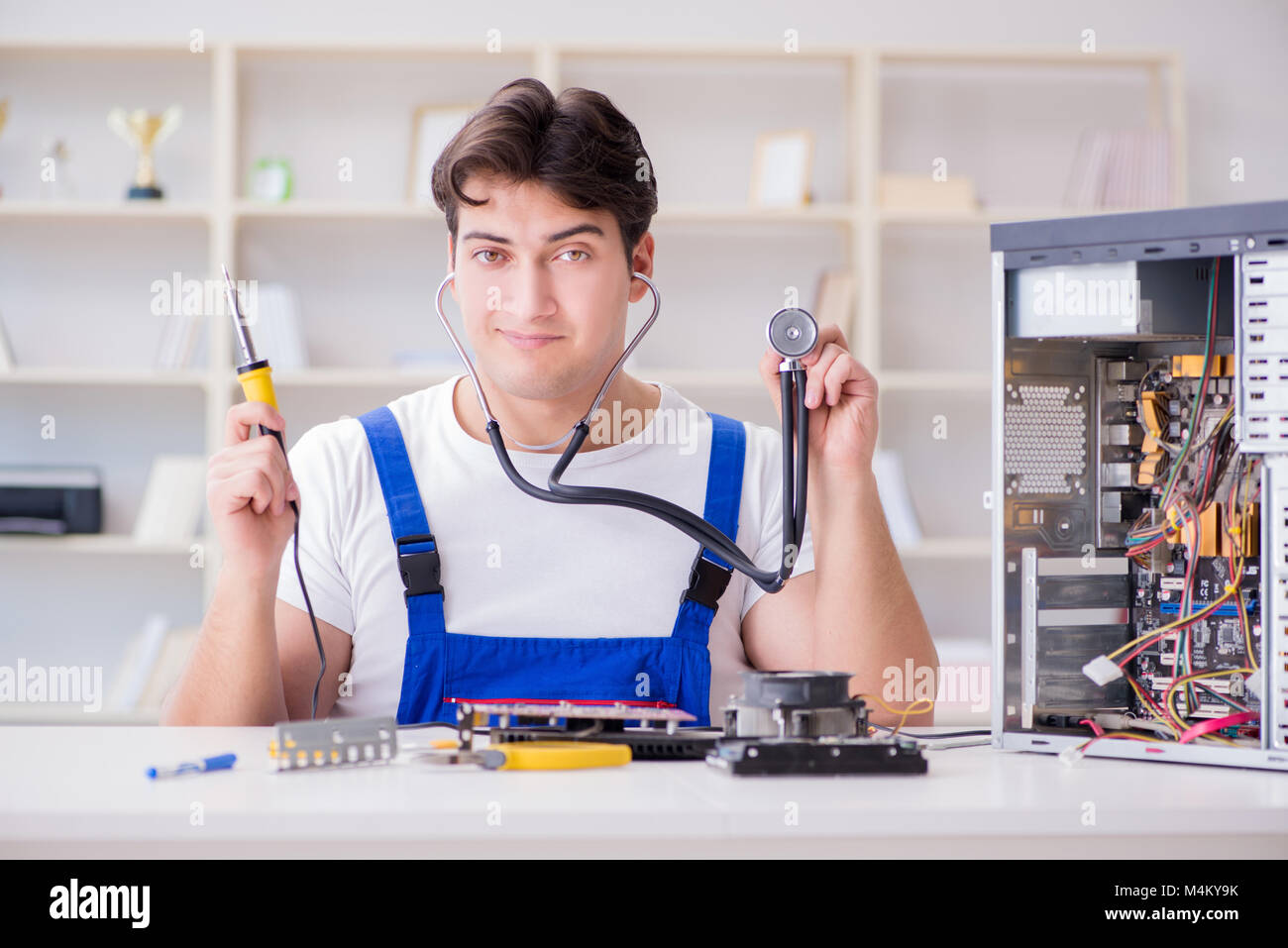 Computer repairman repairing desktop computer Stock Photo - Alamy