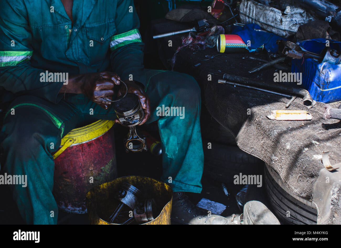 Mechanic repairing auto parts Stock Photo