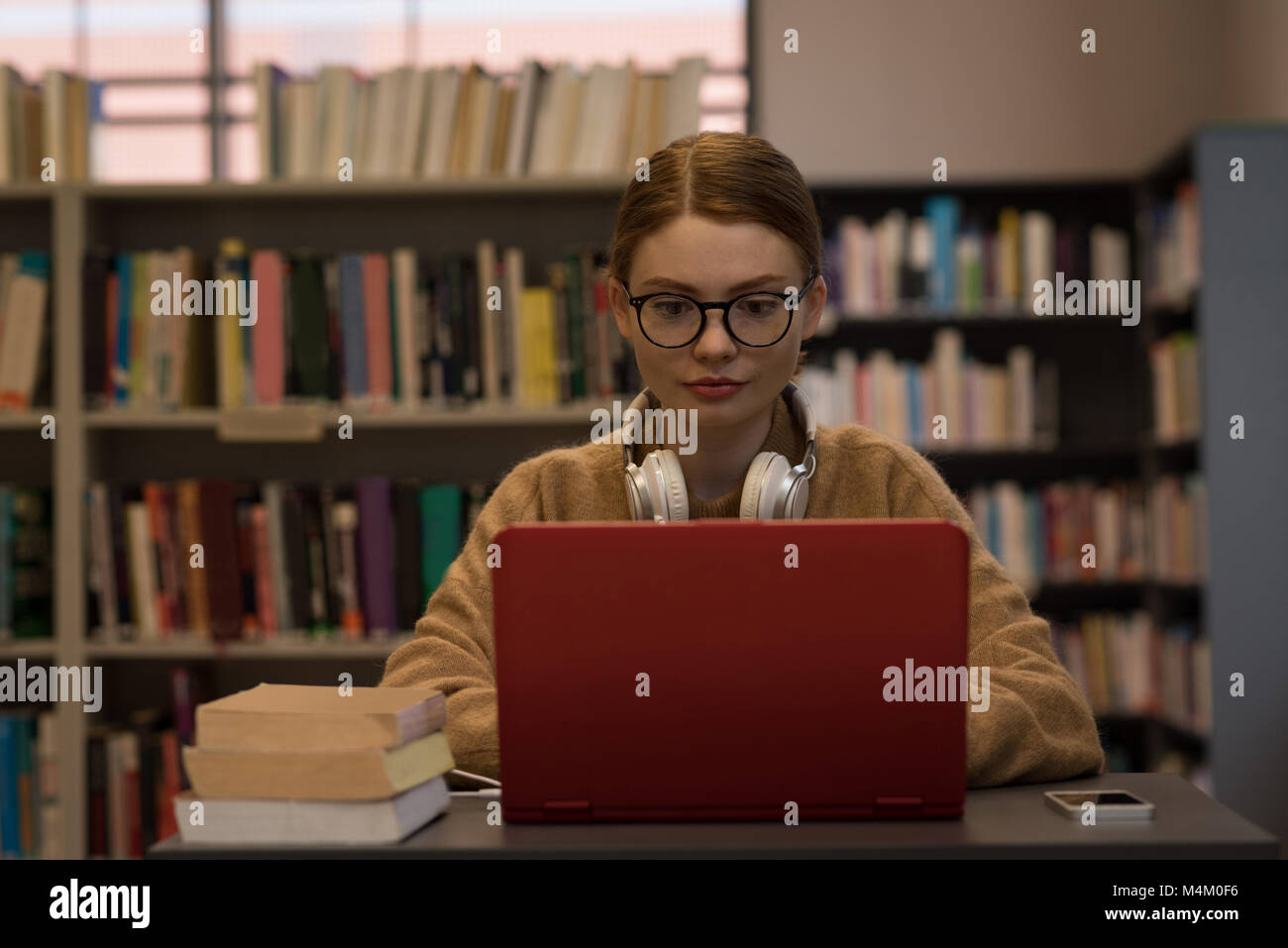 Young woman using a laptop Stock Photo - Alamy