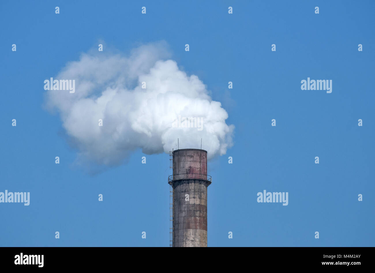 Industrial chimney with smoke Stock Photo
