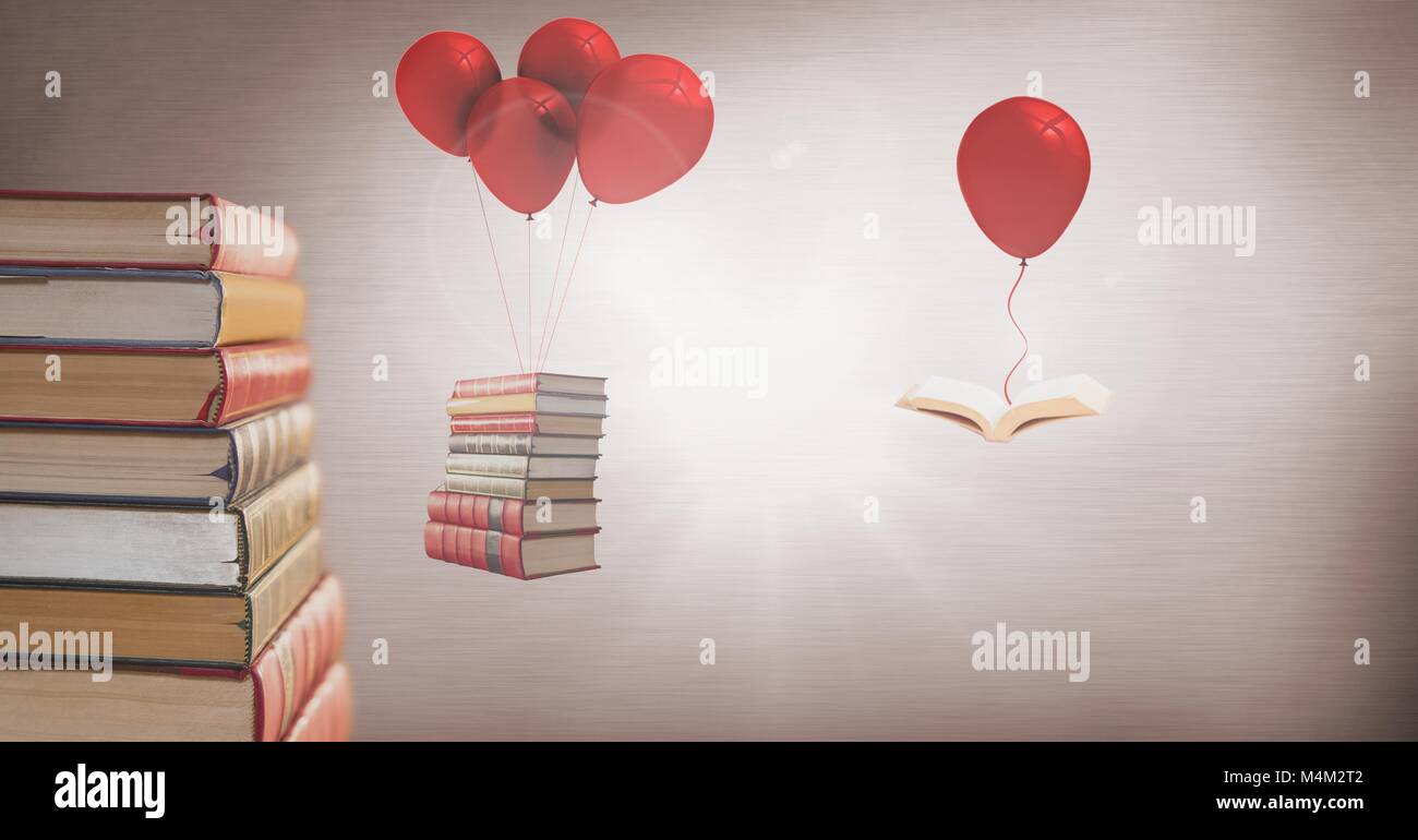 Floating books hanging off surreal balloons Stock Photo