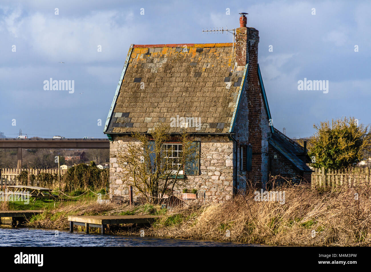 Holiday home in former lock keeper's cottage, Topsham Lock Cottage, Topsham, Devon, UK. Located between the Exeter Canal and River Exe. February 2018. Stock Photo