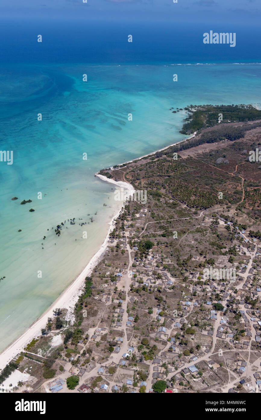 Aerial view of rural town on edge of ocean in Mozambique Stock Photo