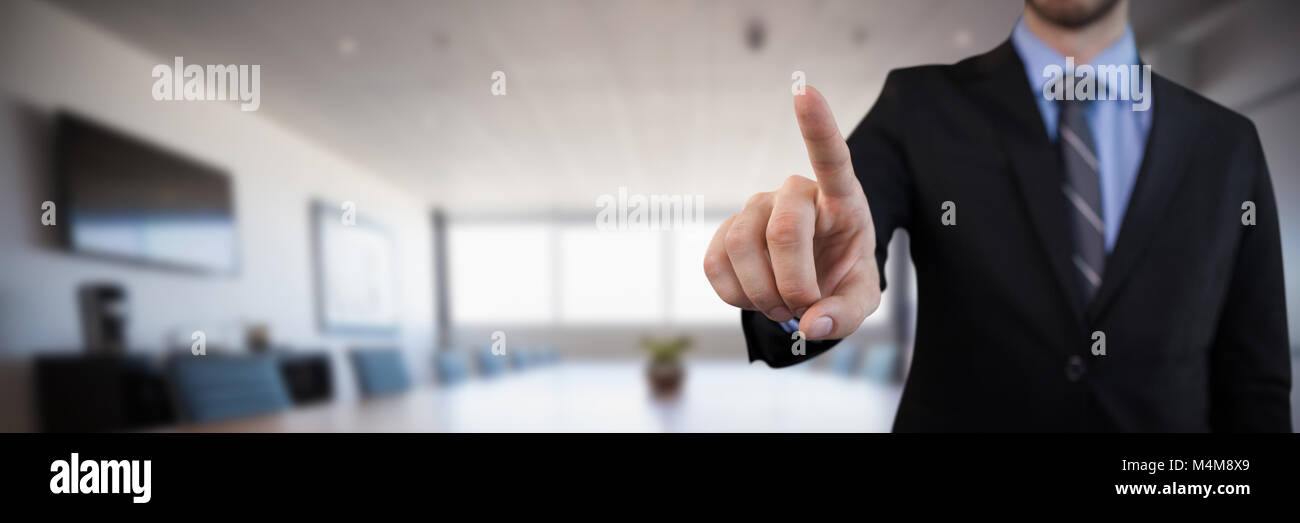 Composite image of mid section of businessman in suit selecting over invisible interface Stock Photo