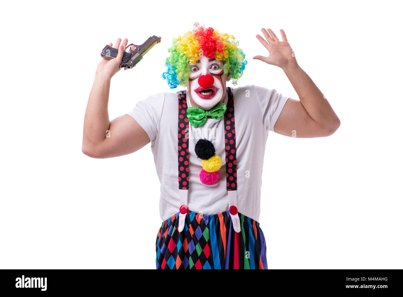 Funny clown with a gun pistol isolated on white background Stock Photo