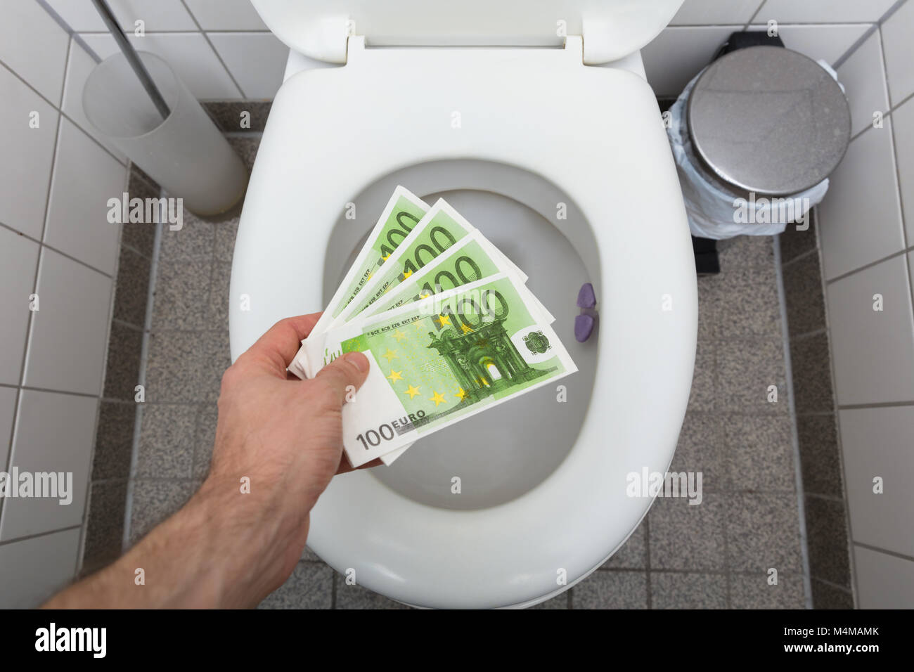 Hand flushing the toilet hires stock photography and images Alamy