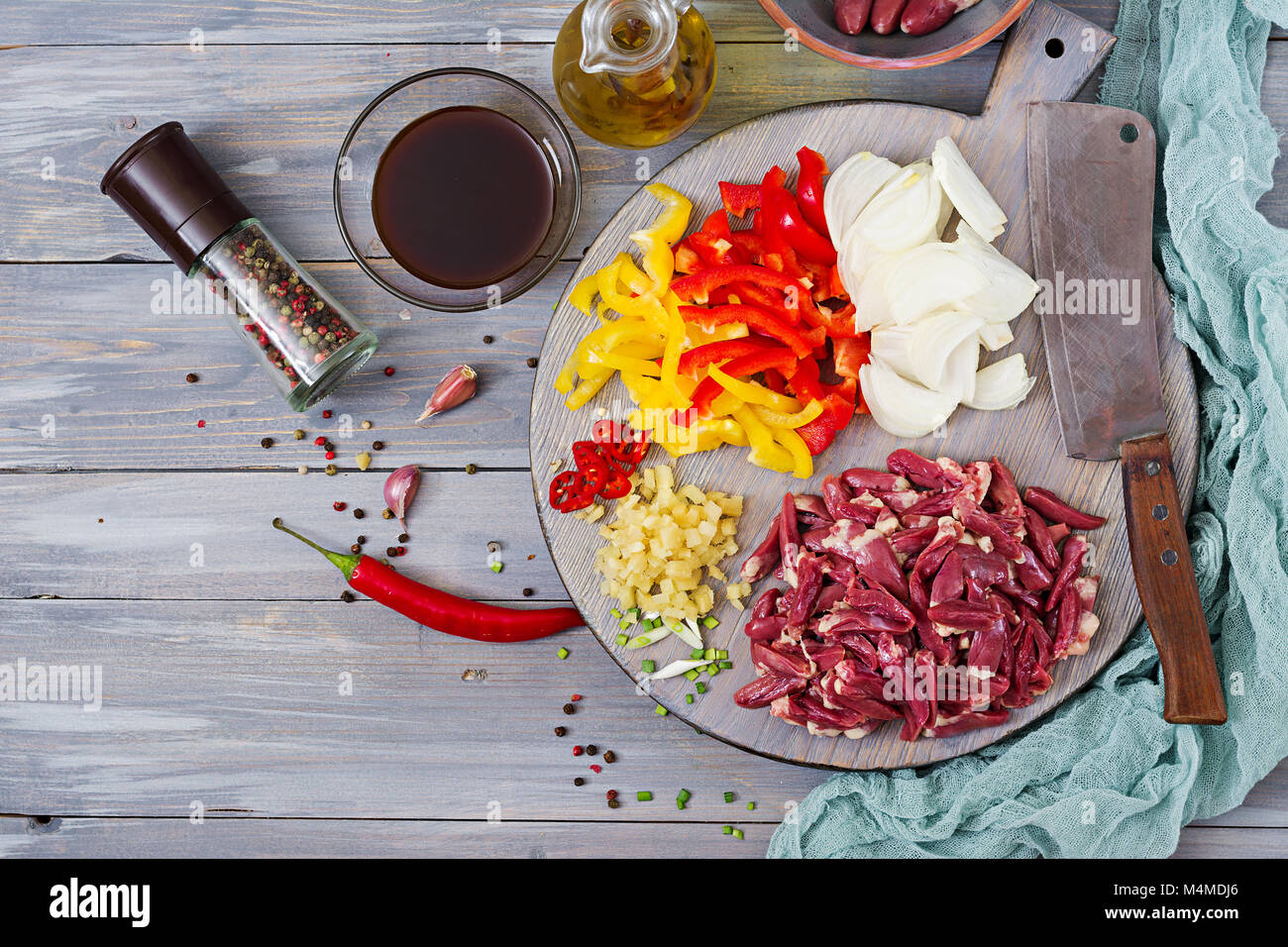 Ingredients for cooking stirfry from chicken hearts, paprika and