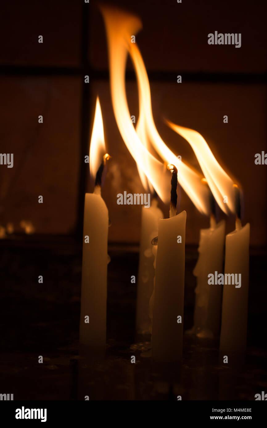 Burning candles with candle light in the dark Stock Photo Alamy