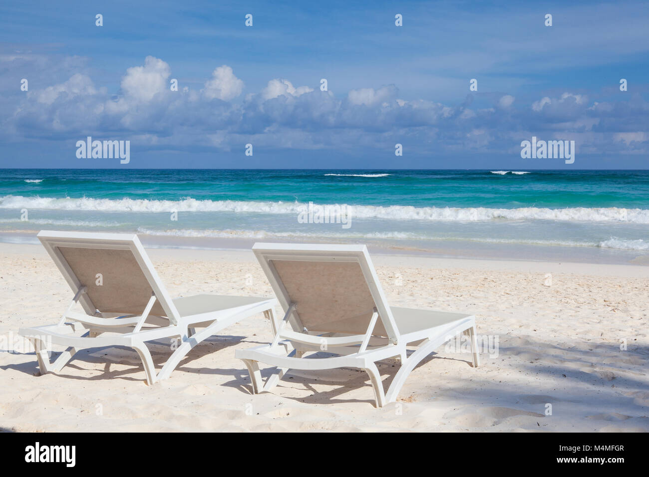 Two white beach chairs on the empty beach in Play del Carmen, Yucatan, Mexico Stock Photo Alamy