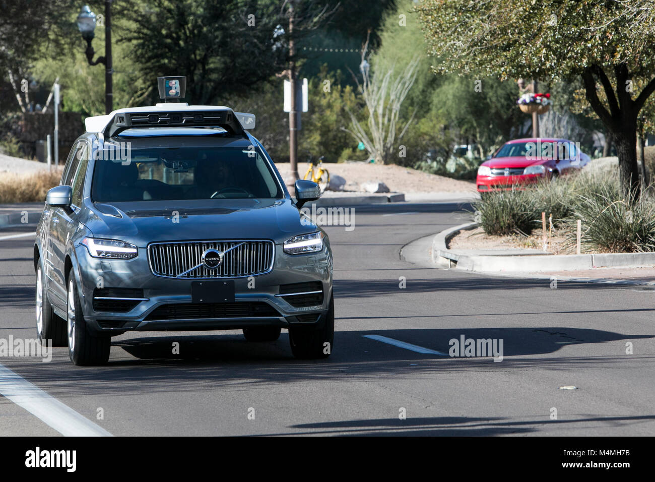 An Uber self-driving autonomous vehicle seen driving in Tempe, Arizona on February 3, 2018. Stock Photo