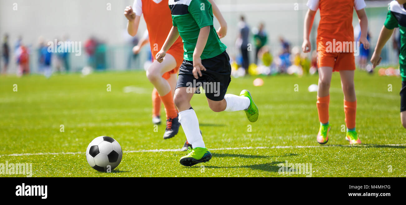 Running Soccer Football Players. Footballers Kicking Football Match