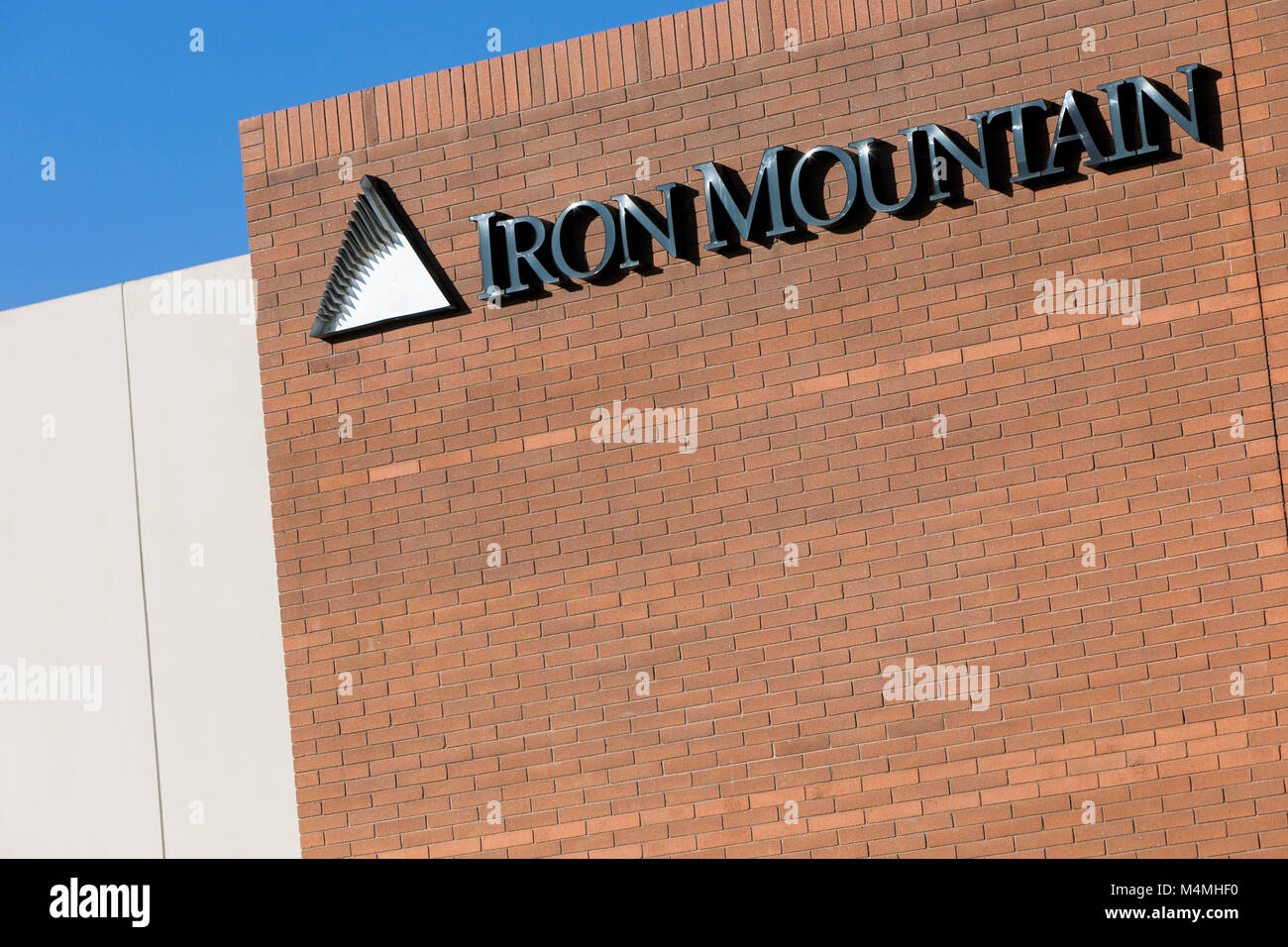 A logo sign outside of a facility occupied by Iron Mountain in Phoenix, Arizona, on February 3, 2018. Stock Photo