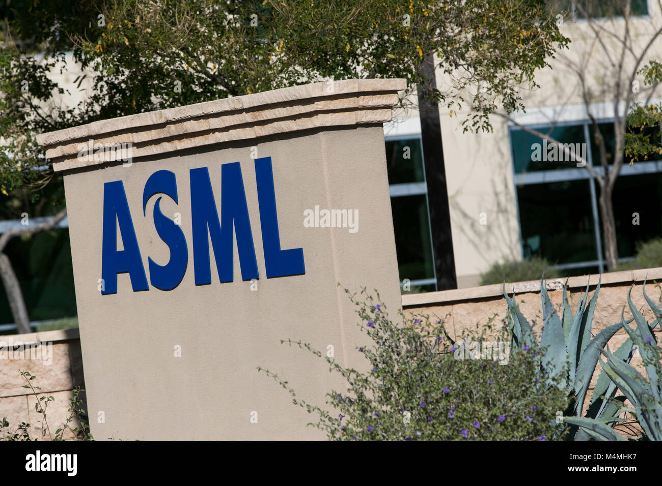 A logo sign outside of a facility occupied by ASML in Chandler, Arizona ...