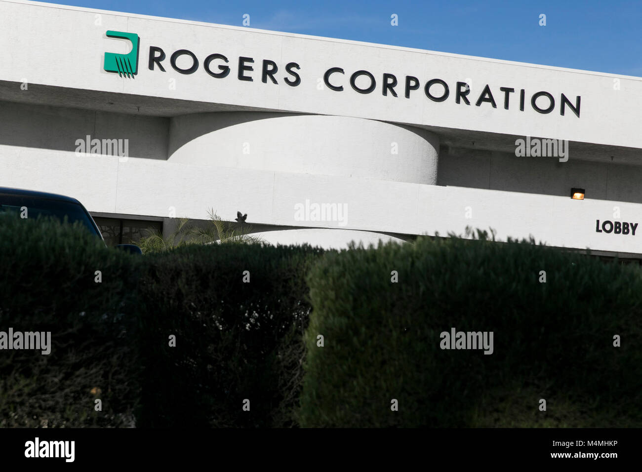A logo sign outside of a facility occupied by the Rogers Corporation in