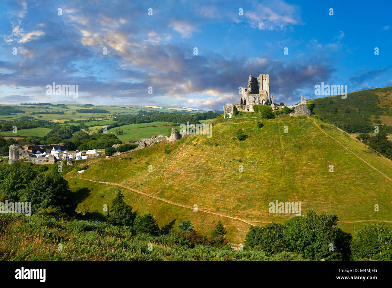 Medieval Corfe castle keep & battlements at sunrise, built in 1086 by William the Conqueror, Dorset England Stock Photo