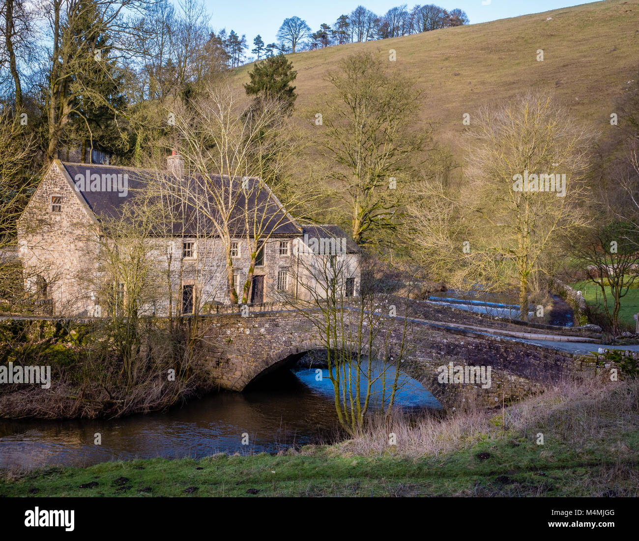 Lode Mill on the Staffordshire bank of the River Dove at Milldale in the Peak District National Park UK Stock Photo