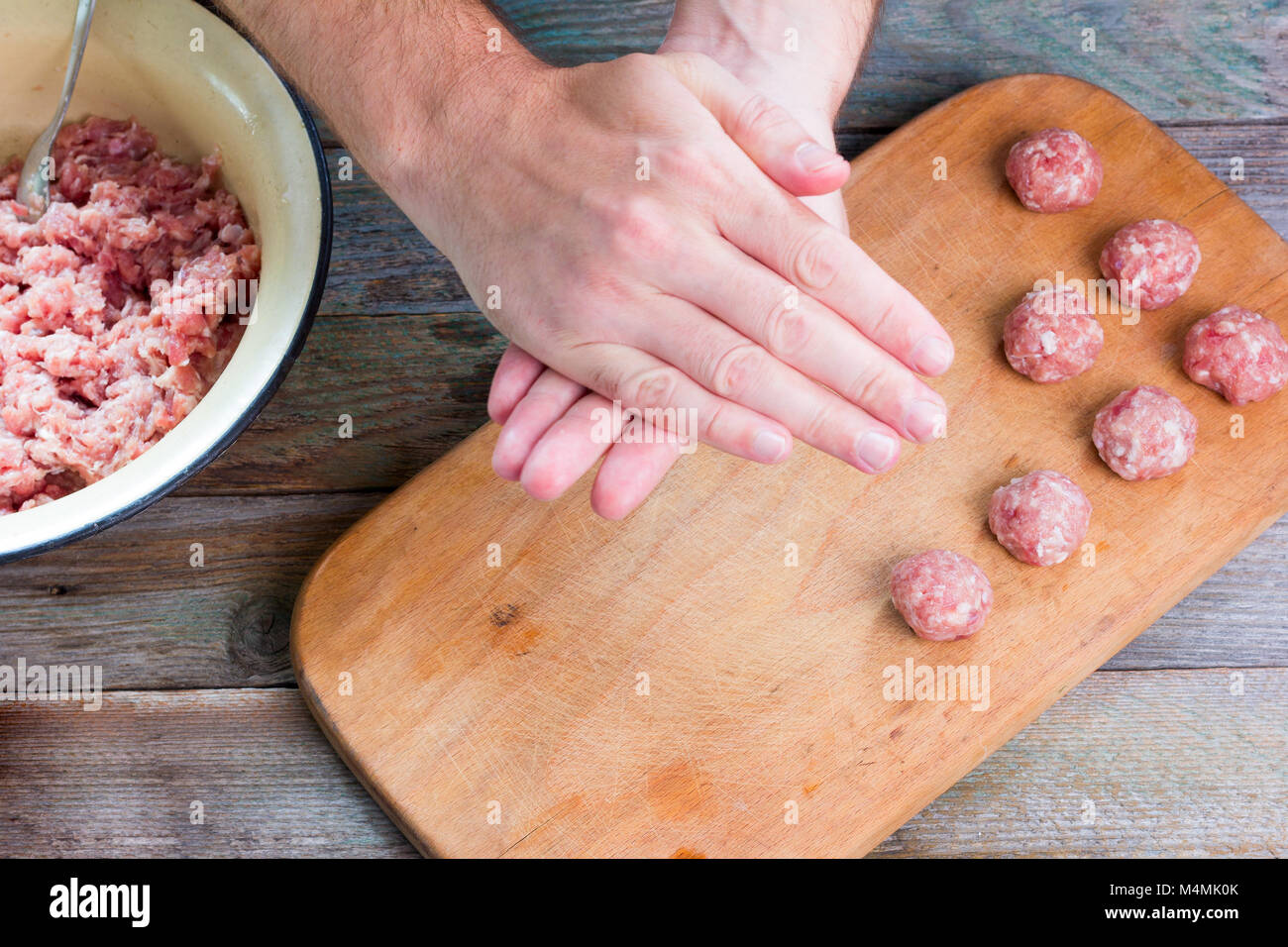 male hands preparing homemade meatballs, top view closeup Stock Photo ...