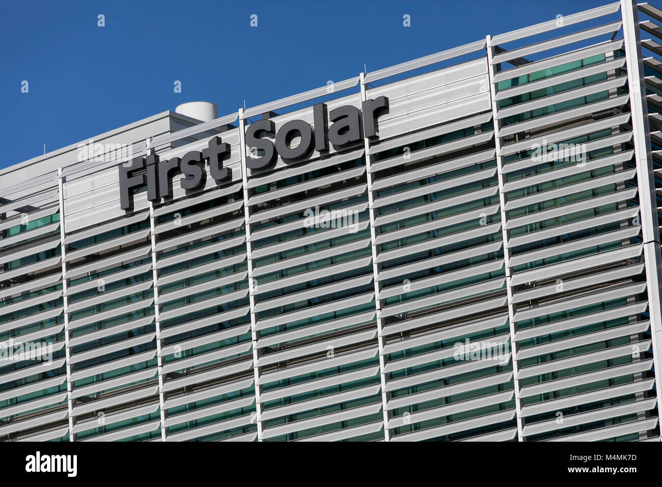 A logo sign outside of the headquarters of First Solar, Inc., in Tempe