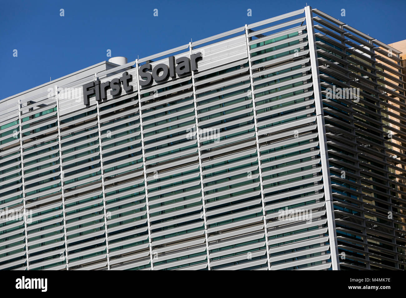 A logo sign outside of the headquarters of First Solar, Inc., in Tempe